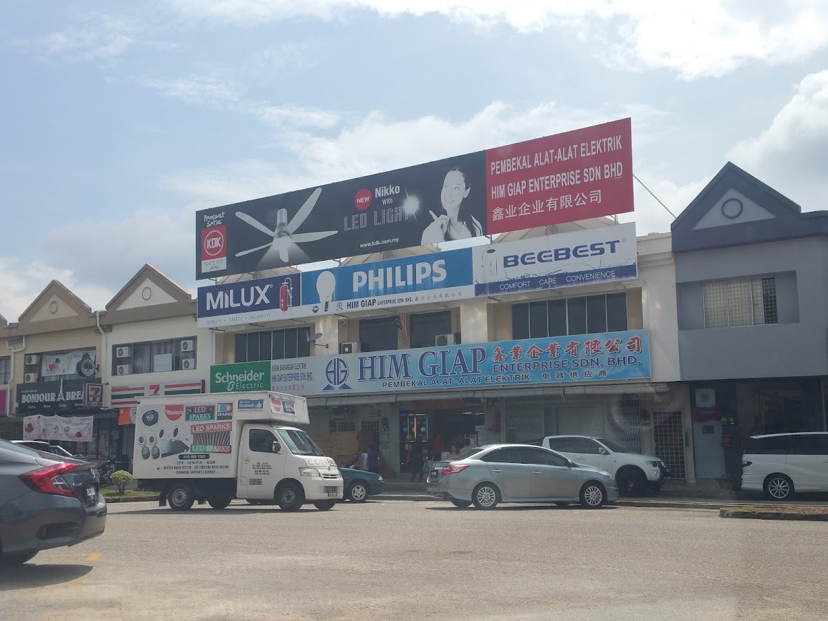 Row of shophouses with a KDK billboard, Philips, Beebest, Milux and Schneider Electric signs and the Him Giap Enterprise signboard