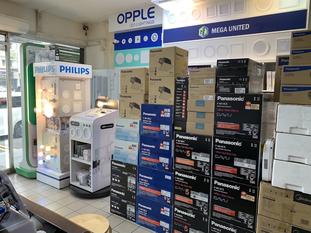 Shop interior with Opple and Mega United lighting display walls, a Philips stand and stacked Panasonic fan boxes