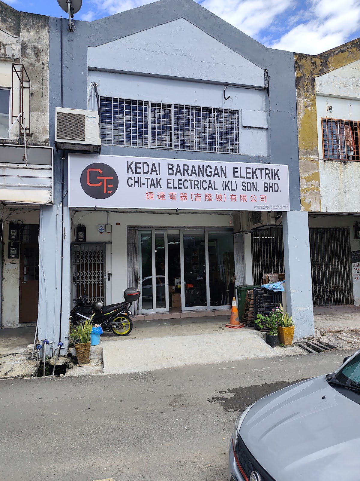 Two-storey shoplot with a white Chi-Tak Electrical (KL) signboard above glass doors