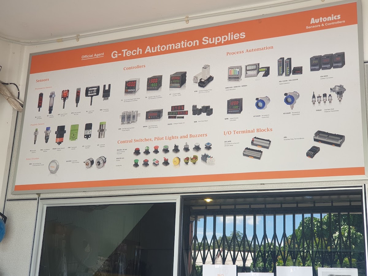 Large orange-bordered board of Autonics sensors, controllers, pilot lights and terminal blocks headed G-Tech Automation Supplies