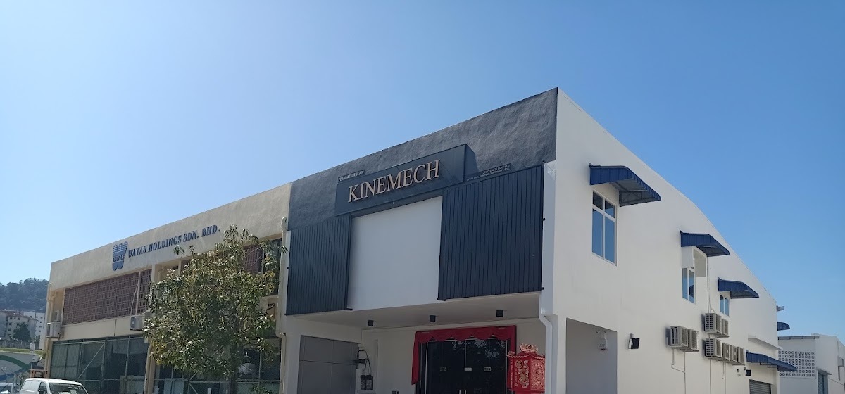 White light-industrial building with a dark Kinemech fascia and blue window awnings