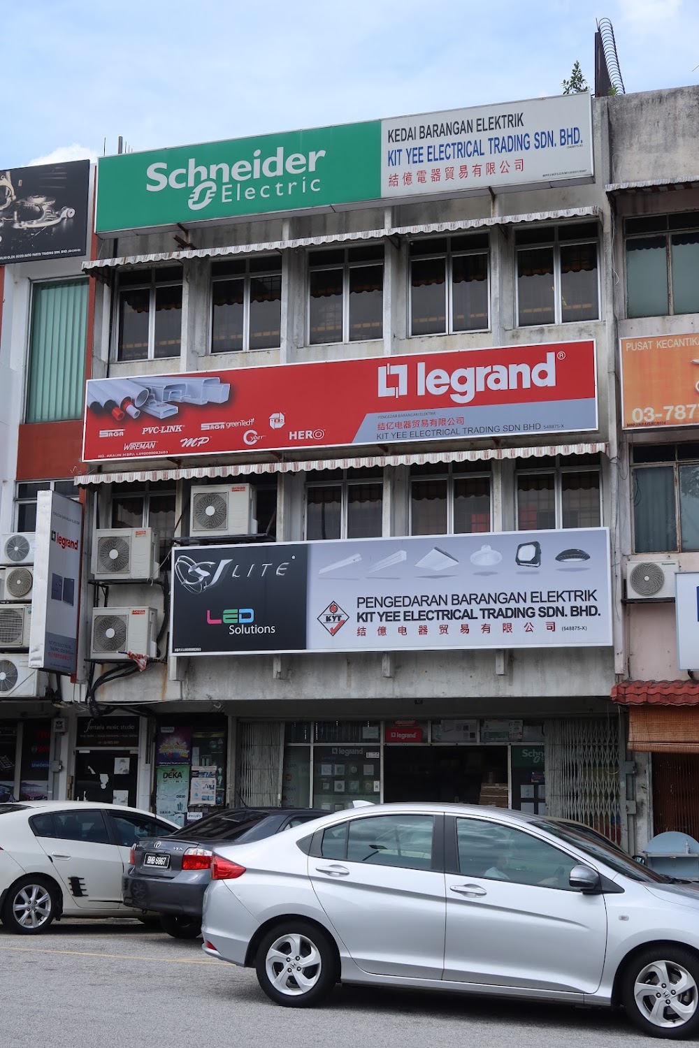 Four-storey shoplot with Schneider Electric, Legrand and SJ Lite signboards for Kit Yee Electrical Trading Sdn Bhd