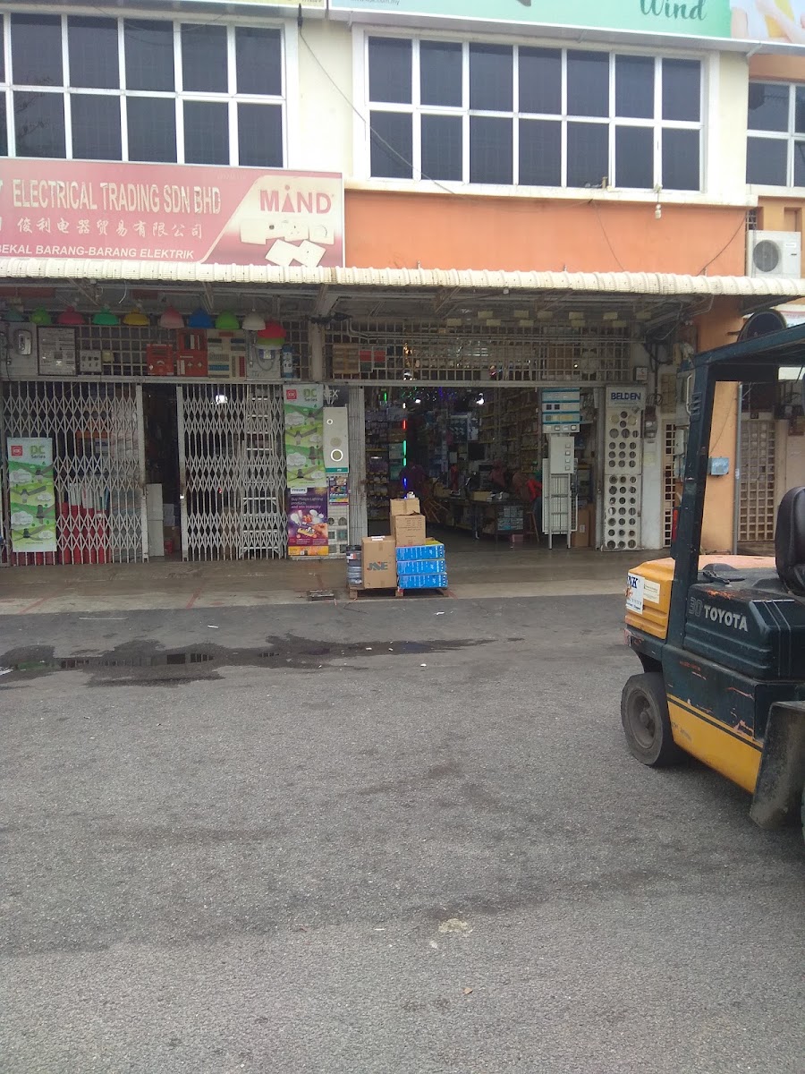 Row-shop electrical store with a red signboard reading Electrical Trading Sdn Bhd and a MIND logo