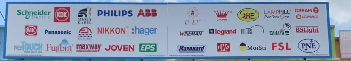 Long white signboard with two panels of brand logos, among them Schneider Electric, KDK, Mega Kabel, Philips, ABB, MK, Panasonic, Nikkon, Hager, EPS, Legrand, Osram, Maxguard and FSL
