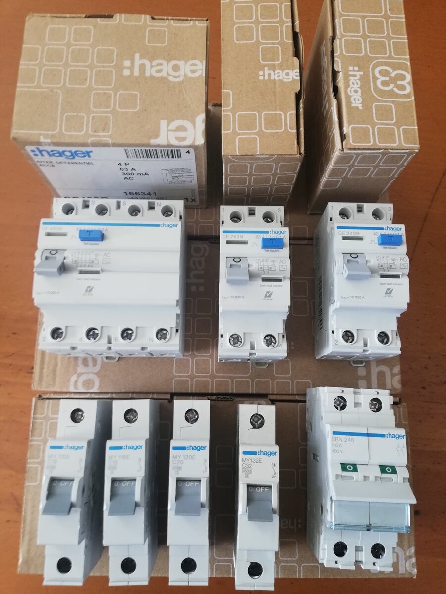 Hager residual current circuit breakers, four single-pole MCBs and a two-pole isolator laid out on Hager boxes