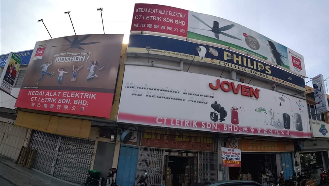 Two-storey shophouse covered in signboards reading Kedai Alat Elektrik CT Letrik Sdn Bhd, with KDK fan, Philips and Joven water-heater advertising