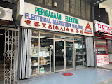 Shopfront of Electrical Marketing Sdn Bhd in Pudu, Kuala Lumpur, showing a signboard in Malay, English and Chinese above glass doors and display windows filled with electrical parts.