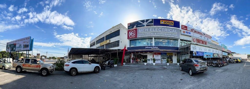 Wide view of a corner shoplot with an MEH Electrical & Hardware Hub signboard, a Jotun sign and a Johnson Suisse band