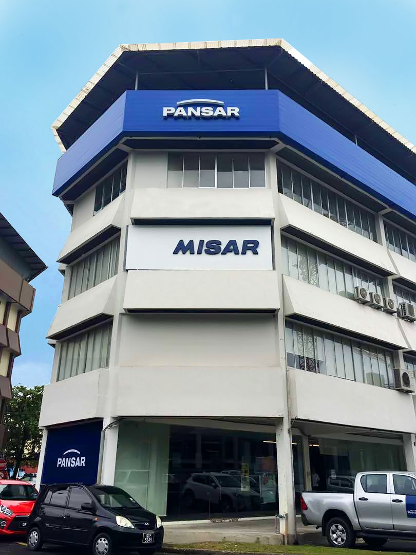 Corner multi-storey building with a blue PANSAR sign at the top and a PANSAR sign at the ground-floor entrance