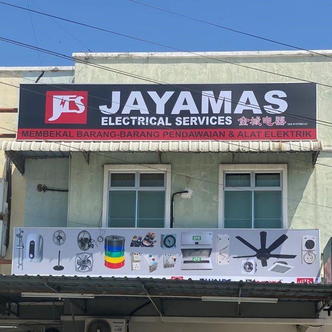 Black Jayamas Electrical Services signboard with a product banner of fans, water heaters and cable reels below