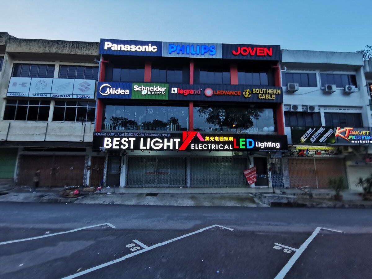 Three-storey shophouse with a lit Best Light Electrical signboard and Panasonic, Philips, Joven, Midea, Schneider, Legrand and Ledvance panels